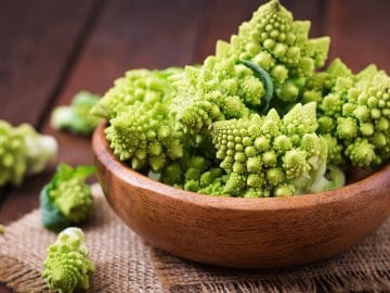 Cabbage romanesco on a dark wooden background